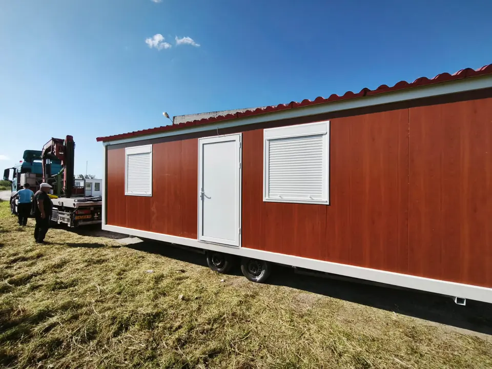 Wood-look Classic Line with a tiled roof, placed on grass