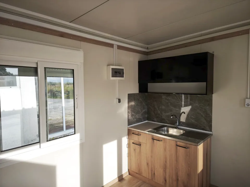 Kitchenette with a timber cabinet and sink