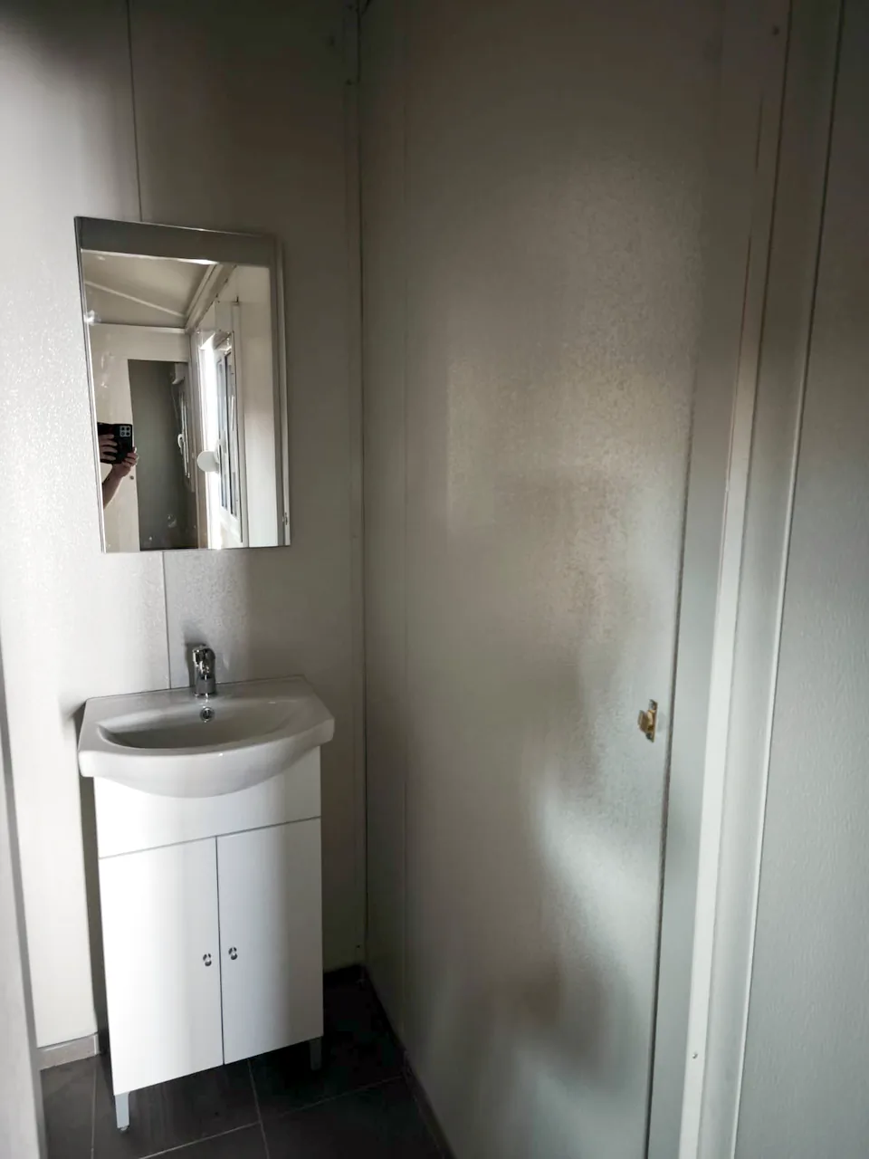 Vanity basin and mirror in the bathroom