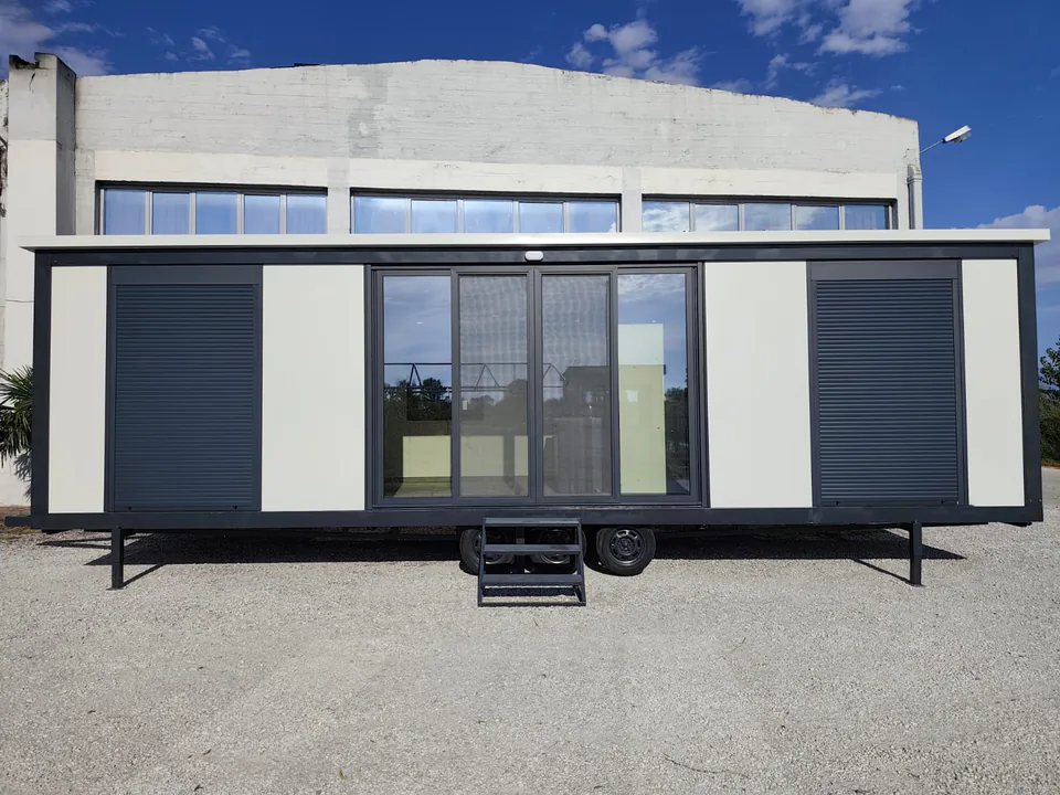 Modern Line seen straight on, with a sliding glass door and two shuttered windows